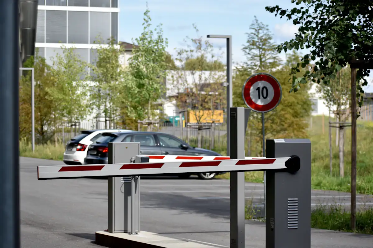 Automatic boom barrier beside a gate control post