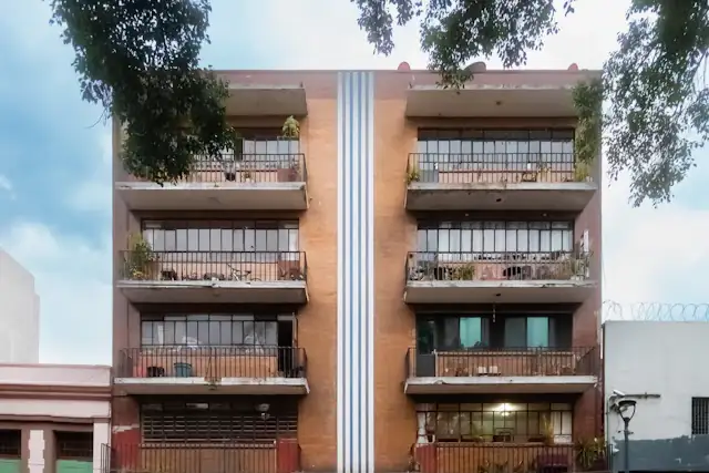Mixed-use building with shops below apartments