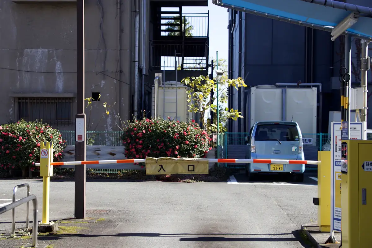 Boom barrier at a vehicle entrance