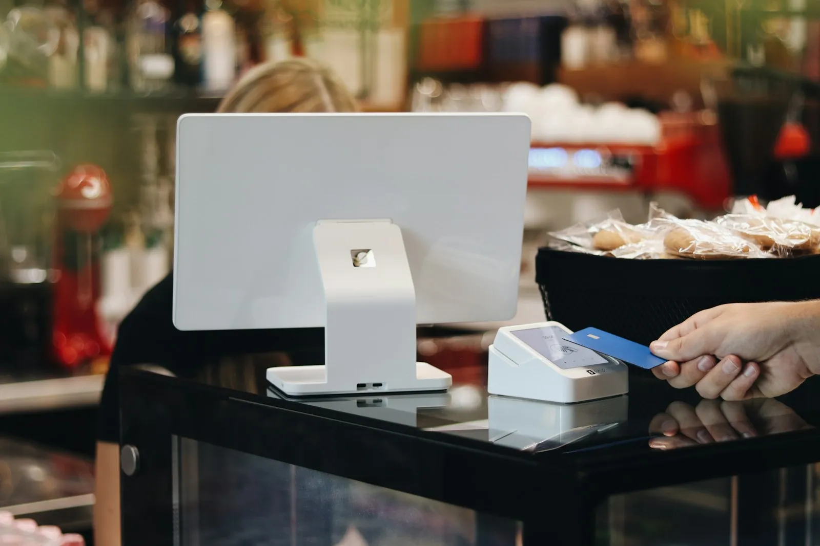 Customer paying at a POS