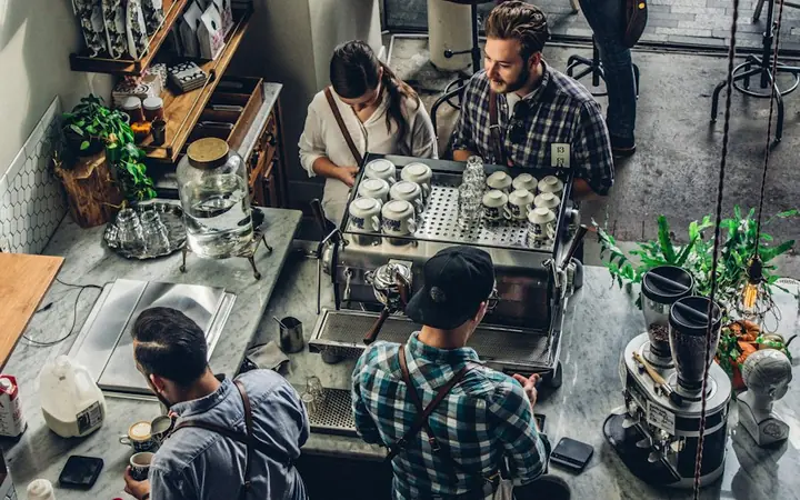 Customer buying coffee at a counter
