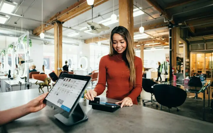 Customer paying at a counter terminal