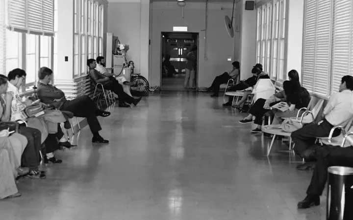 People waiting in a hospital hallway