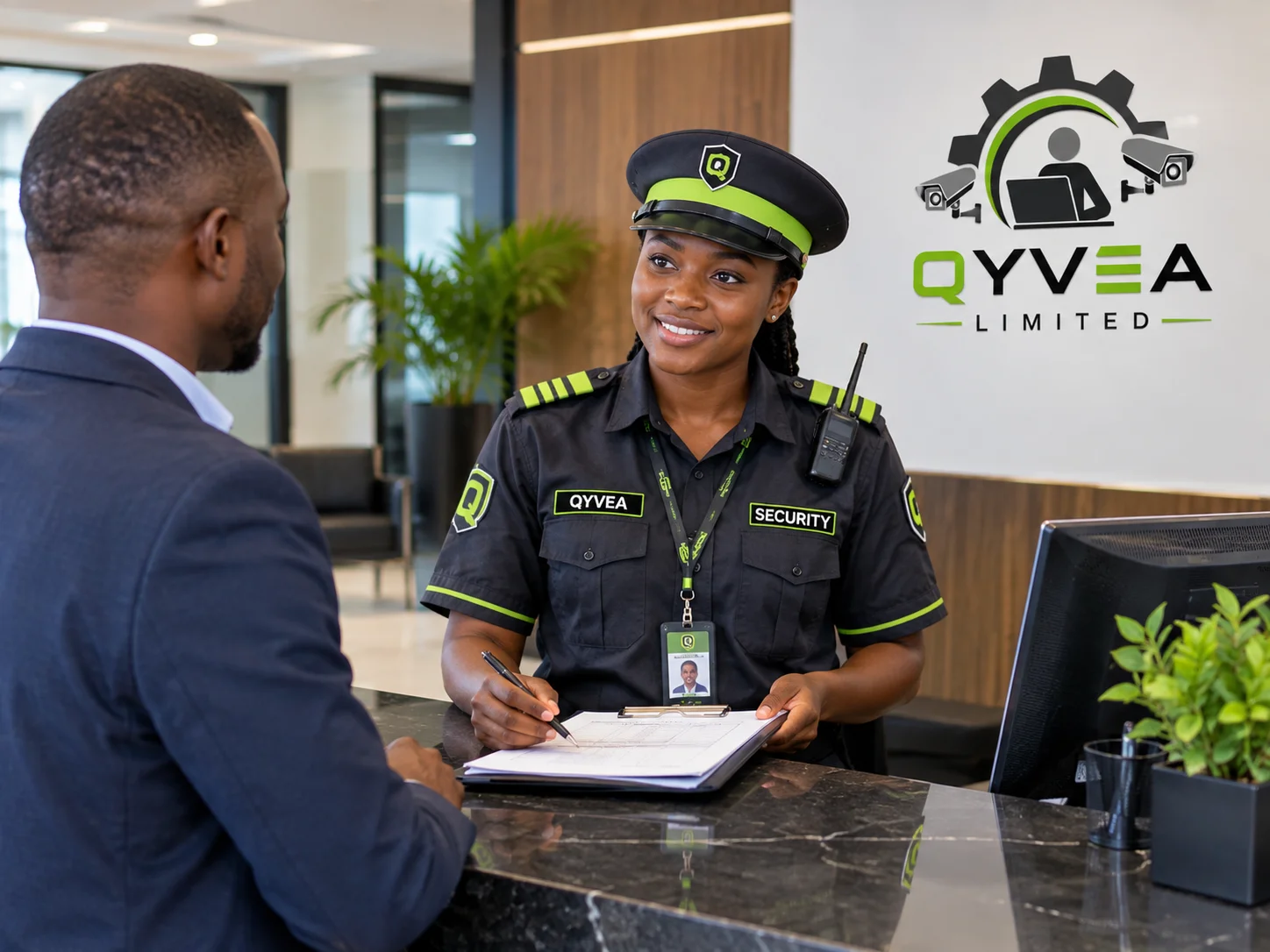 Qyvea security officer at a reception desk logging a visitor in a notebook
