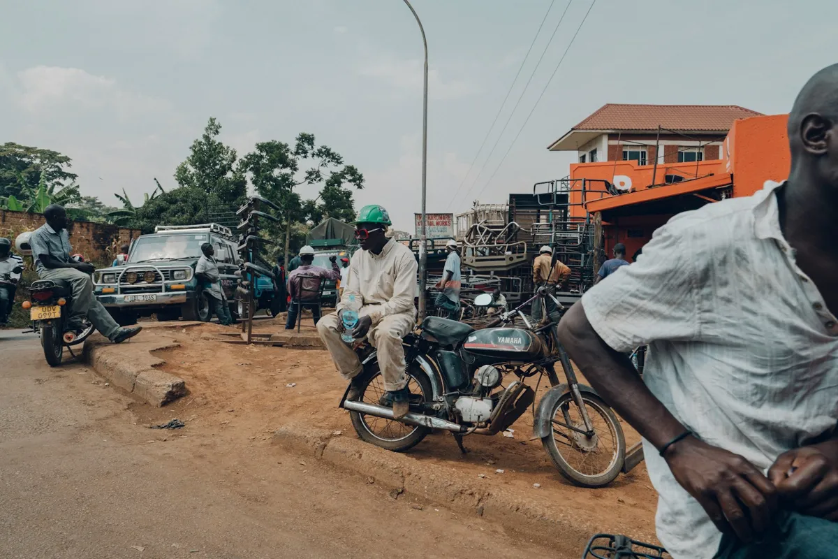 Motorcycle riders waiting at a roadside stage
