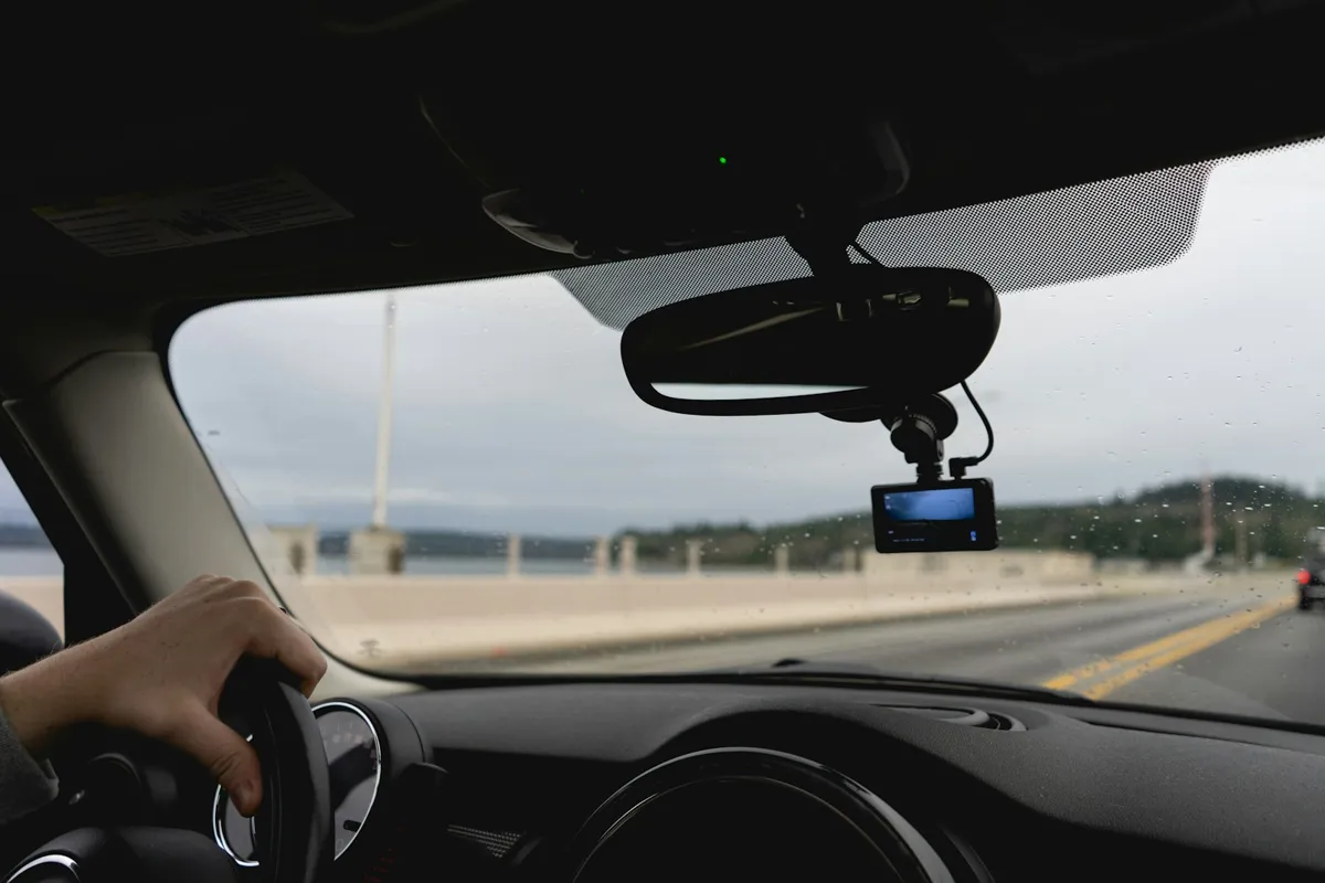 Dash camera mounted behind the rear-view mirror