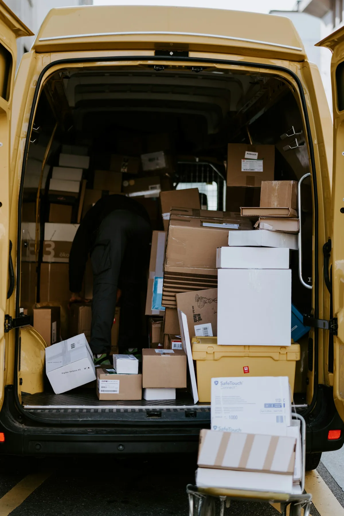 Boxes being loaded into a delivery van